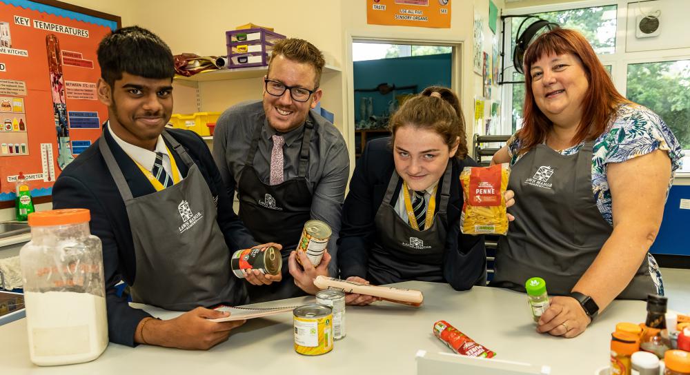 Lawn Manor Academy students Ruben (left) and Paris with Marek Koza and Sarah Smith