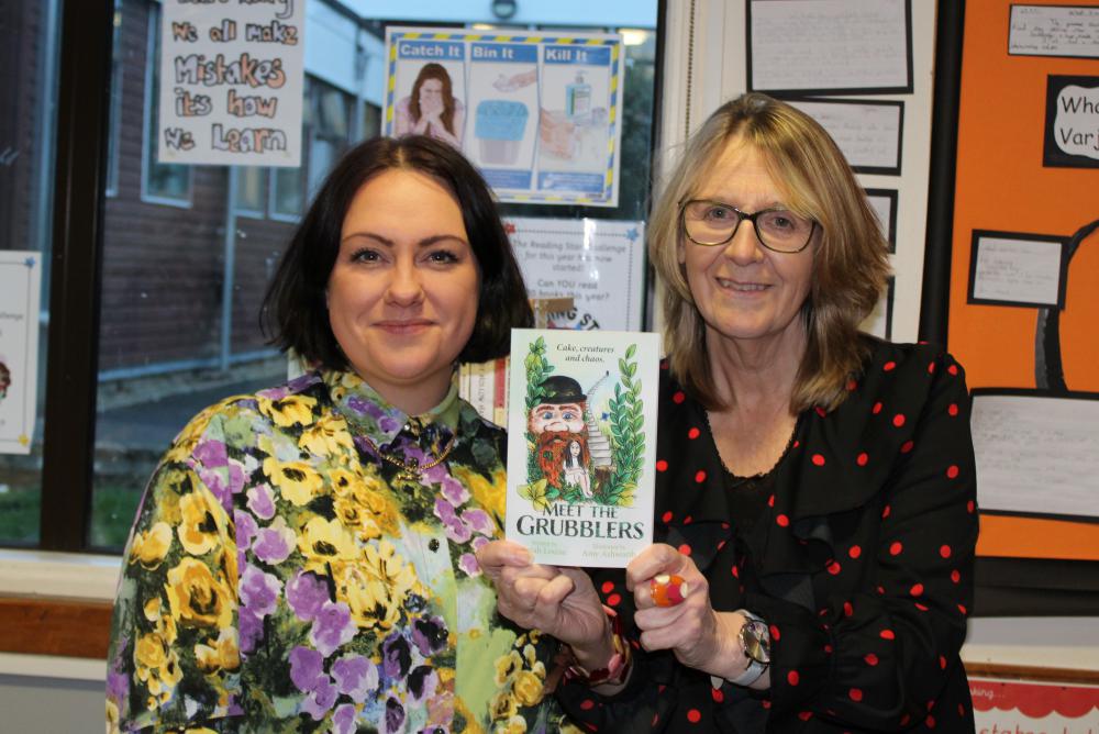 Sarah Louise (right) and Amy with a copy of Meet The Grubblers