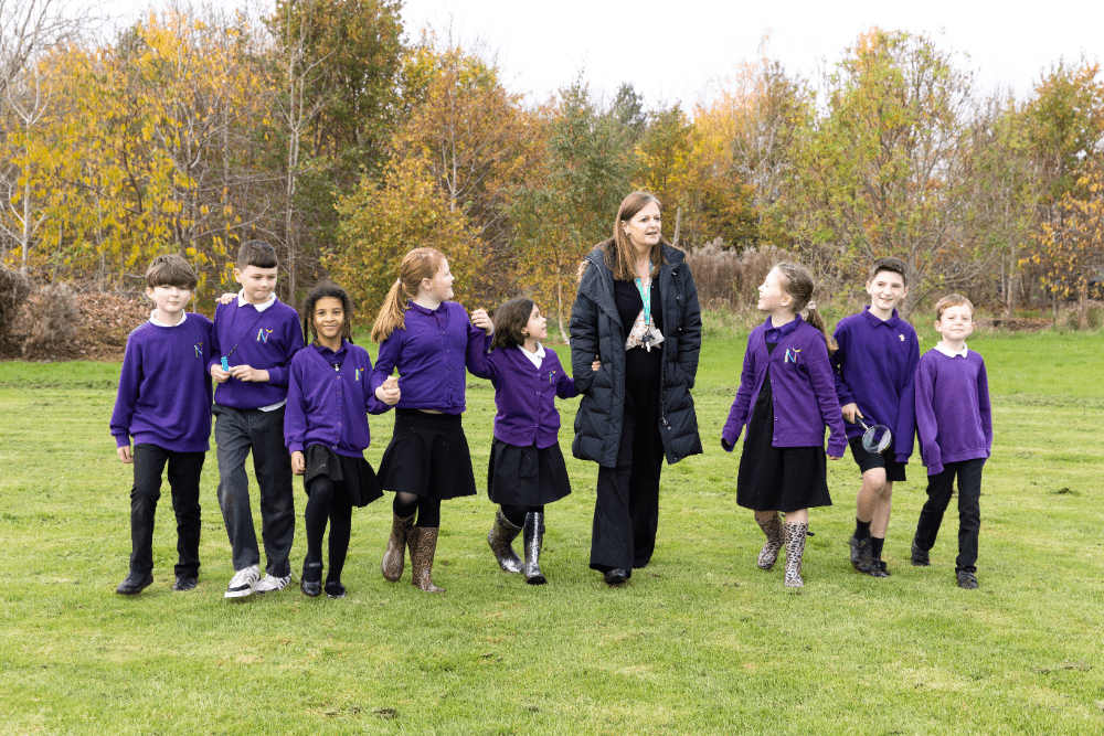 Principal Gudrun Osborn, with students