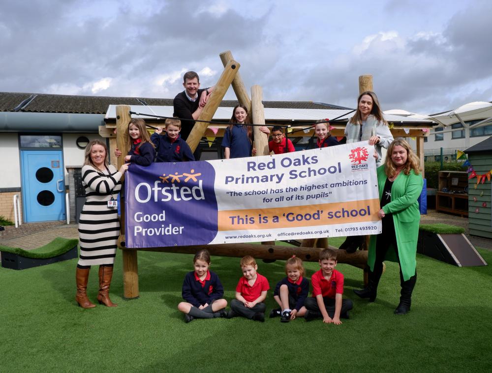 L-R Mrs Mandy Jacques (Acting Deputy), Mr James Lee (Deputy), Mrs Emily Maxfield (Head) & Mrs Rachel Surch (Director of Primary) and pupils from Nursery to Year 6