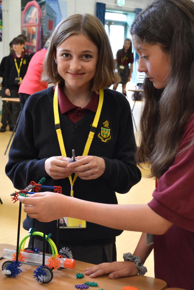 Students Mia Aldous, left, and Kate Curley try the Bloodhound challenge