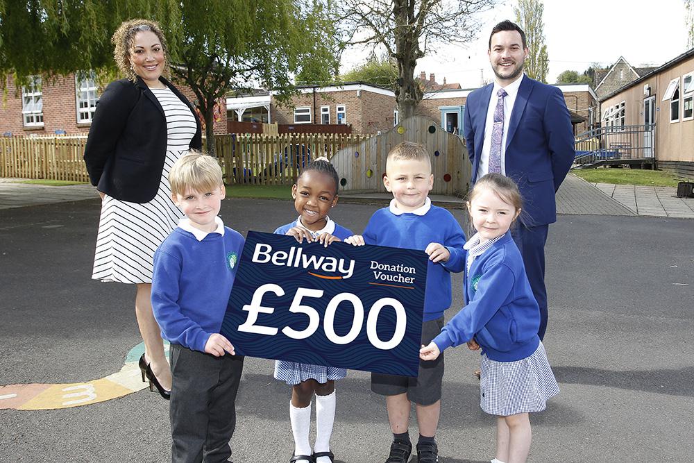 Bellway South West Sales Manager Christel Hawkins, Wroughton Infant School headteacher Ashley Barrington-Wilding and children from the school