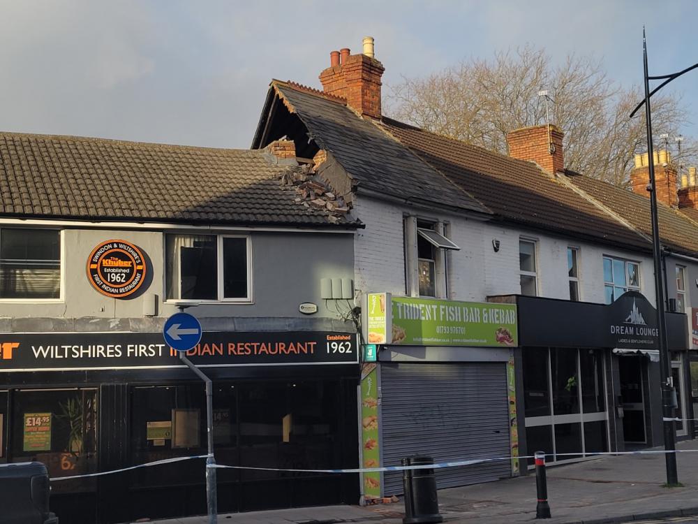 A wall at the top of the building housing the Trident Fish Bar and Kebab was partially destroyed