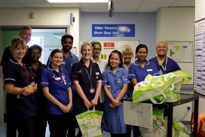 Chief Nurse, Julie Marshman and Matron Gastroenterology and Respiratory, Kevin Jenner handing out goodie bags to nurses on the ward