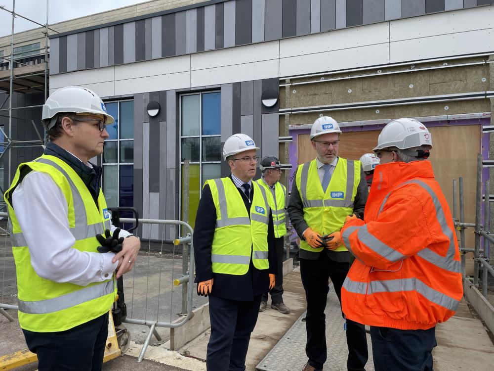 Sir Robert Buckland, centre, and Justin Tomlinson, second from right, toured the site