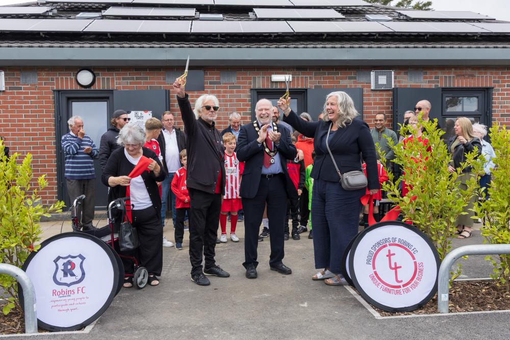 The ribbon-cutting ceremony. Front from left: Robins FC Secretary Theresa Trueman, Chairman Paul Wainwright, Deputy Mayor of Swindon and South Swindon Parish Council Chair Cllr Neil Hopkins and South Swindon MP Heidi Alexander