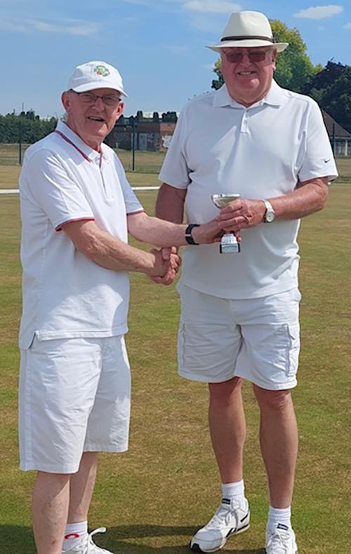 Tournament Organiser Tony Tomlin (L) presents the trophy to Clive Smith