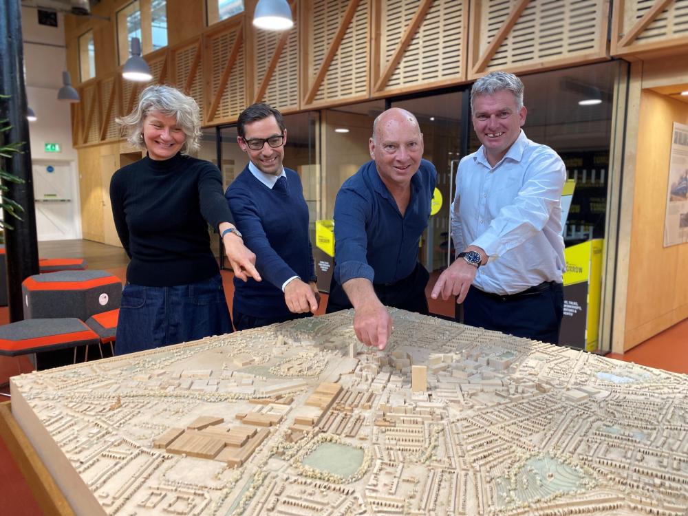 Partners after signing the Memorandum of Understanding at the Carriage Works pointing to The Works area of Swindon (left to right: Karen Phimister (SBC), Barnaby Rich (GLL), Bob Wright (Swindon Heritage Preservation), David Dewart (SBC)