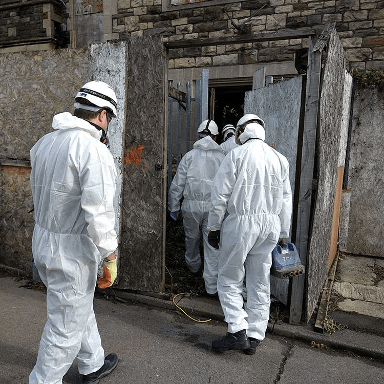Surveyors entering the building to undertake the hazardous materials survey