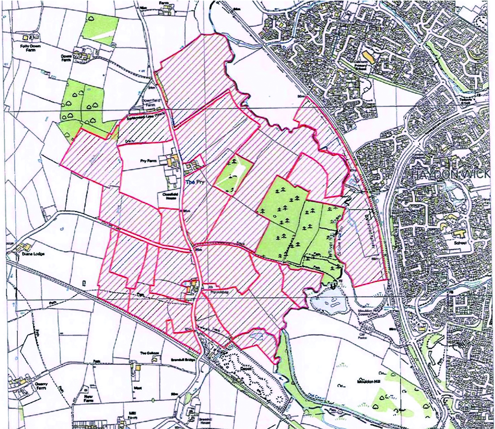 The red-shaded area is the proposed site for new housing