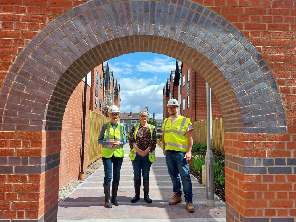 From left: Councillor Jane Milner Barry (Chair of the Policy Development Achieve Net Zero Committee), Councillor Janine Howarth (Cabinet Member for Housing) and Councillor Tom Butcher (Vice Chair of the Policy Development Achieve Net Zero Committee) at the development at Queens Drive