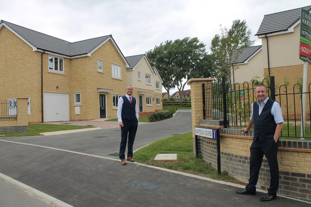 Adam Gatier, Project Director for Swindon Housing Company (left) with Cllr Gary Sumner, Cabinet Member for Strategic Planning, (right) by the new homes.