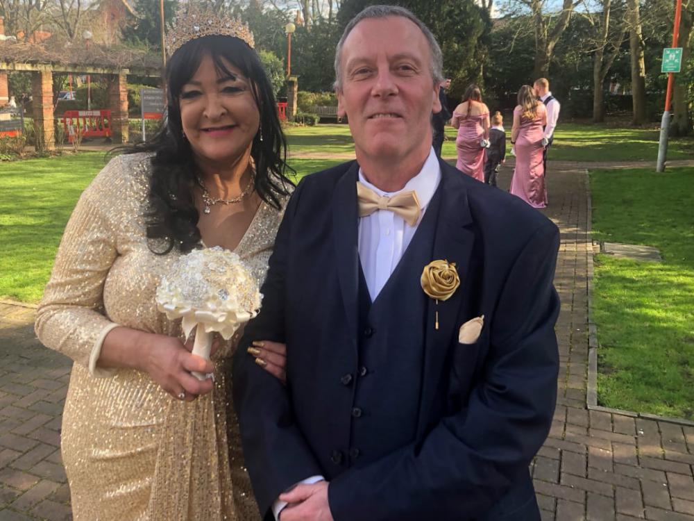 The happy couple in The Rose Garden outside the Register Office