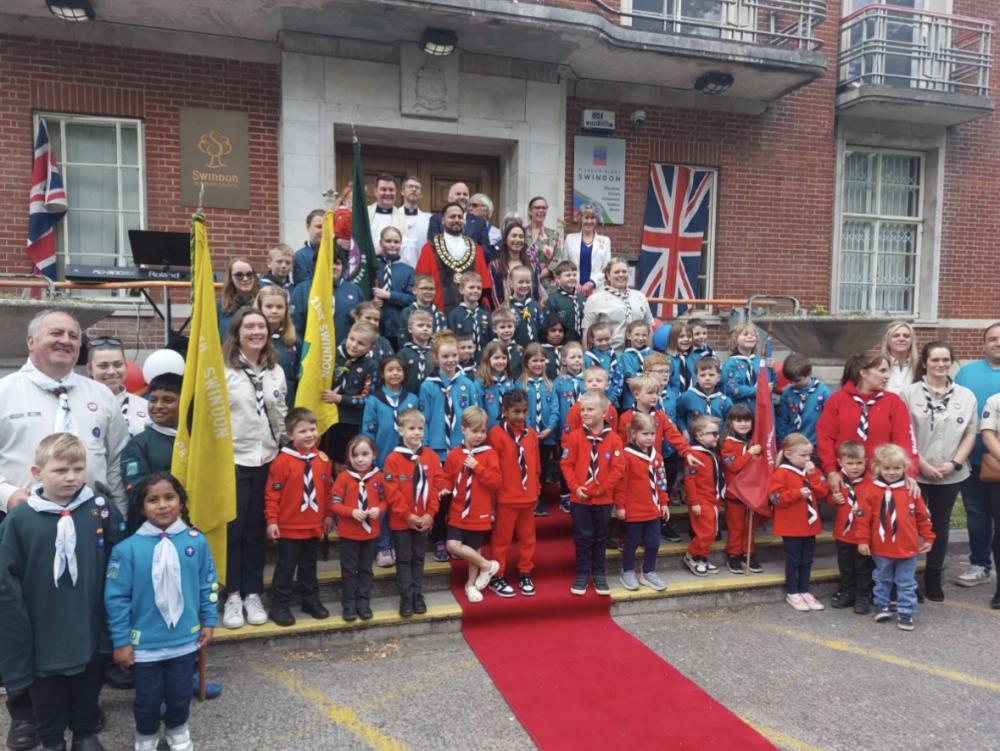 The Mayor, Councillor Imtiyaz Shaikh and Leader of the Council, Councillor Jim Robbins are joined by local Brownie and Scout groups who attended in full uniform at a flag-raising ceremony.
