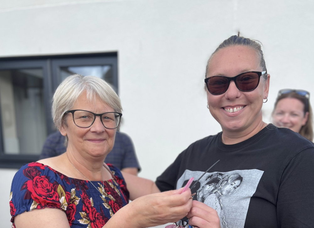 Cllr Janine Howarth, handing over keys to Amber, one of the new residents in Ashley Close