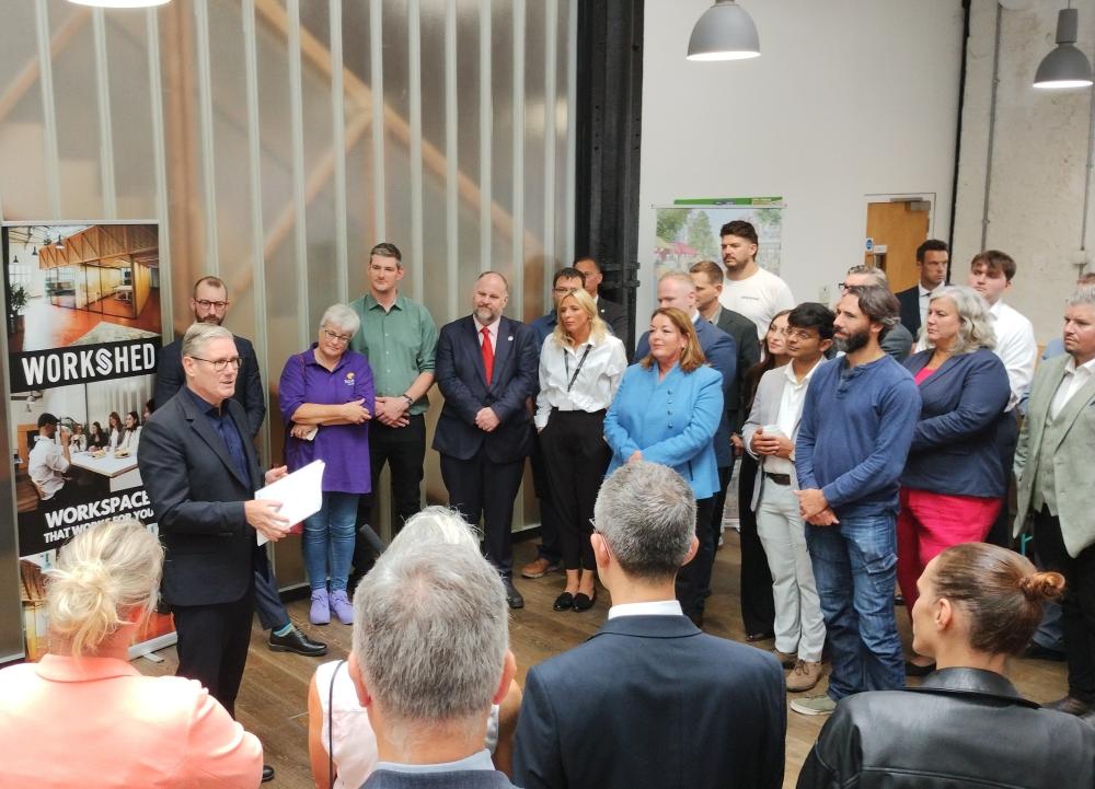 Prime Minister Keir Starmer with guests at The Workshed in the Carriage Works