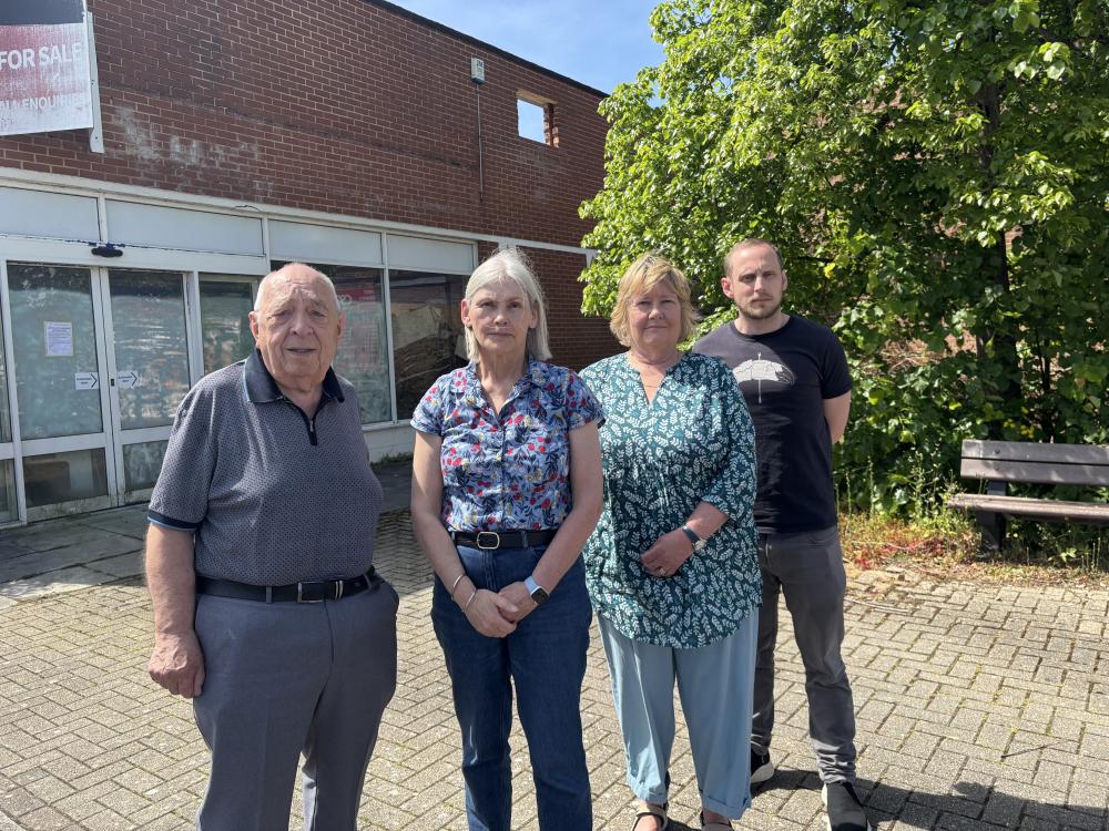 Parish councillors outside the former supermarket