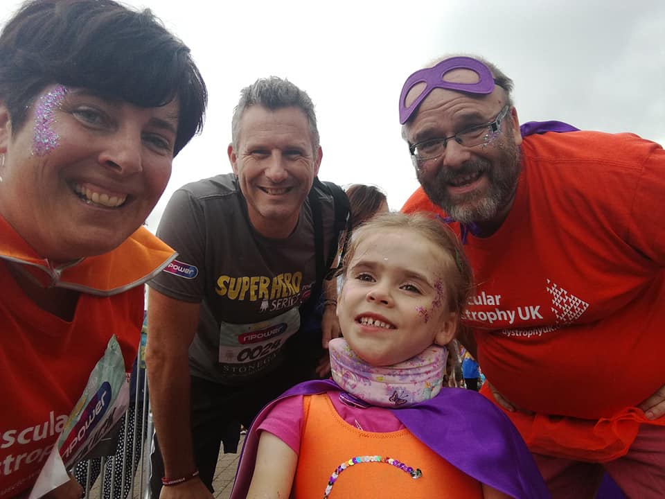 Carmela, aged 4, with parents Lucy and Darren as well as celebrity team mate Adam Hills