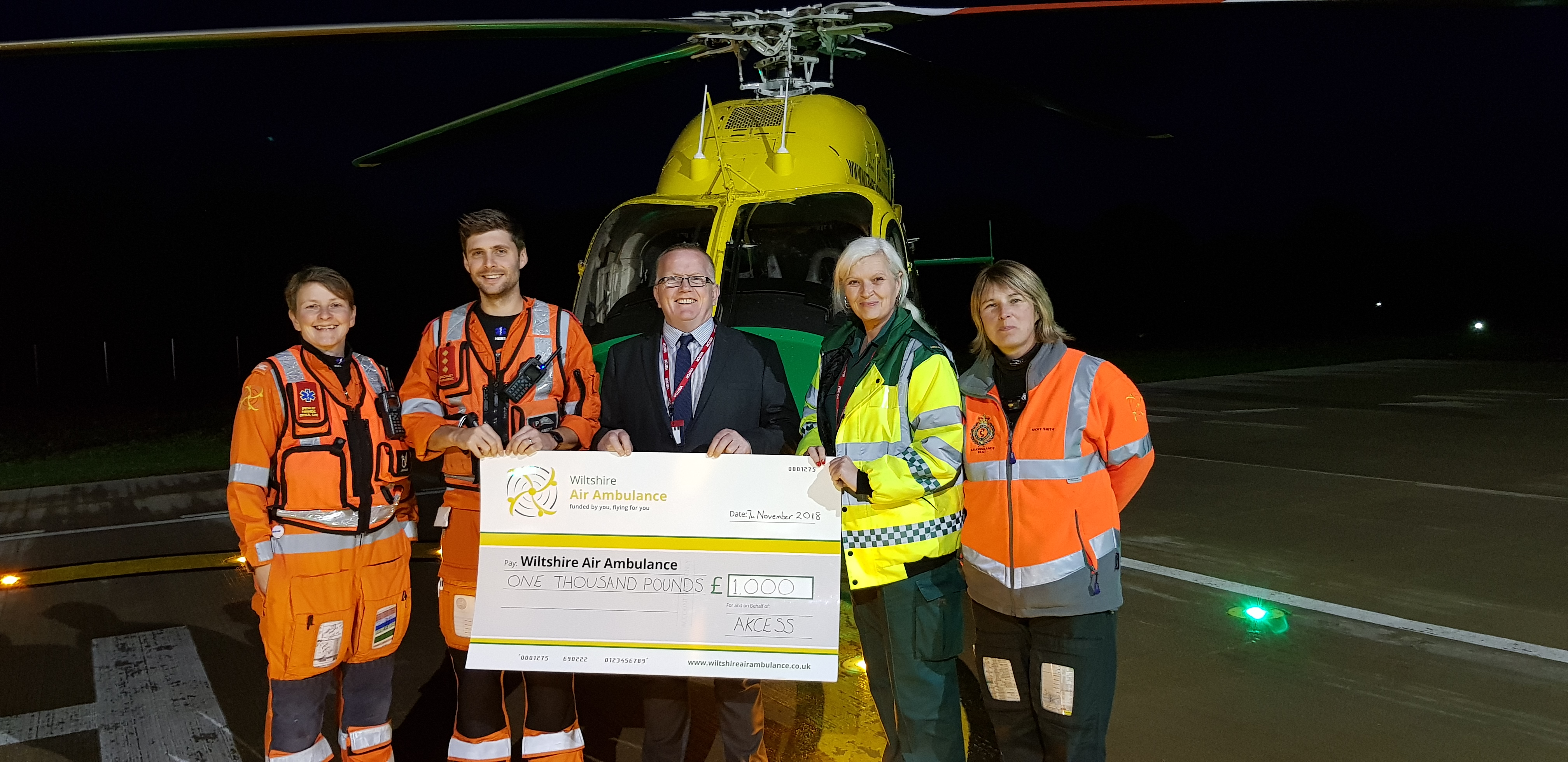 Dave Hyde and Tracey Mason, of Akcess Medical, with (from left) Wiltshire Air Ambulance paramedics Louise Cox and Ben Abbott, and pilot Nicky Smith.