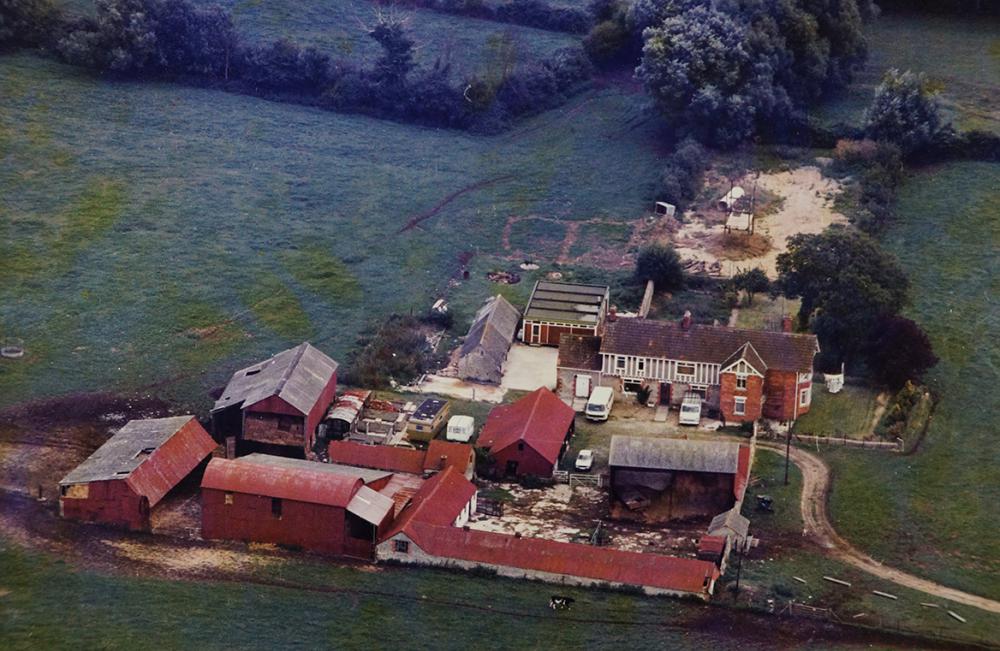 Roughmoor Farmhouse and outbuildings. The Washpool road was located to the west, below the image, and modern day Swinley Drive would later be built next to the hedgeline at the top of the picture