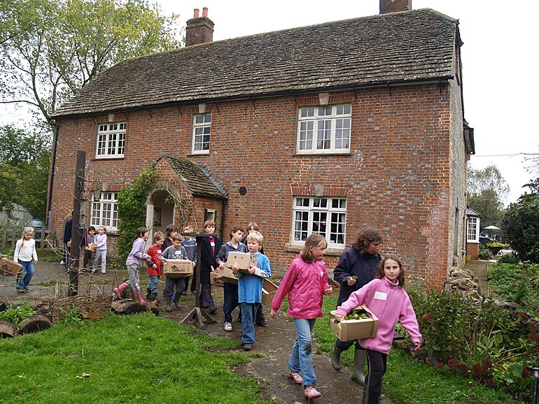 October 2006: Carrying apples of juice in front of Lower Shaw Farm
